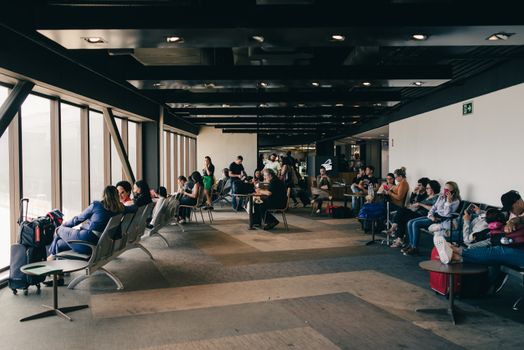 Travellers in an airport lounge