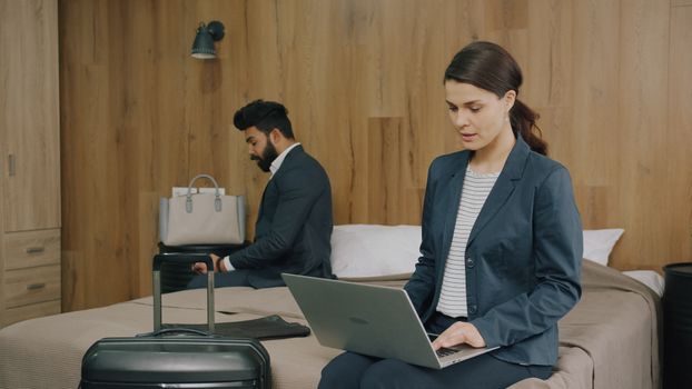 Business traveller using Wi‑Fi in airport lounge