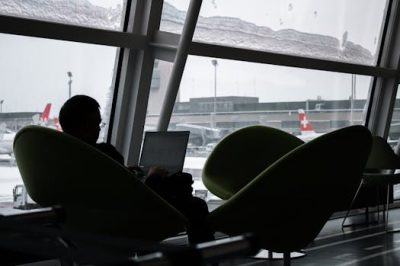traveller working in airport lounge